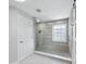 Beautiful shower with glass enclosure and unique gray-toned tile at 3959 Somerset Dr # 5, Sarasota, FL 34242