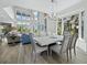 Dining area features modern decor and leads into a bright, spacious living area at 3959 Somerset Dr, Sarasota, FL 34242