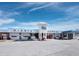 Well-maintained Siesta Market building with a white facade, clear signage, and ample parking at 3959 Somerset Dr, Sarasota, FL 34242