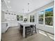 Stylish kitchen with center island, stools, stainless appliances, and bright windows at 3959 Somerset Dr, Sarasota, FL 34242