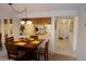 Dining area with modern lighting adjoining the kitchen area and living room at 4016 Oakview Dr # J6, Punta Gorda, FL 33980