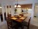 Comfortable dining area with a dark wood table and seating for four, adjacent to the kitchen space at 4016 Oakview Dr # J6, Punta Gorda, FL 33980