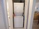 Convenient laundry area with a stackable washer and dryer unit inside the unit at 4016 Oakview Dr # J6, Punta Gorda, FL 33980