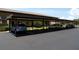Condo complex parking area with shaded spots and guest parking for easy and accessible accommodations at 4016 Oakview Dr # J6, Punta Gorda, FL 33980