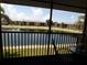 Scenic patio overlooking a serene pond and surrounding lush greenery at 4016 Oakview Dr # J6, Punta Gorda, FL 33980