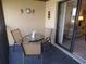 Cozy patio with a table and chairs, perfect for enjoying outdoor living at 4016 Oakview Dr # J6, Punta Gorda, FL 33980