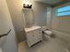 Freshly remodeled bathroom featuring a vanity with marble countertop and updated fixtures at 4031 Wake Ave, Sarasota, FL 34241