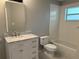 Modern bathroom featuring updated vanity, fixtures, and tiled floors at 4031 Wake Ave, Sarasota, FL 34241