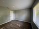 Freshly painted bedroom with new laminate flooring and a window for natural light at 4031 Wake Ave, Sarasota, FL 34241