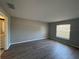 This bedroom features stylish wood floors and a window that brings in natural light at 4031 Wake Ave, Sarasota, FL 34241