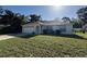 Charming single-story home with a well-maintained lawn and attached two-car garage at 4031 Wake Ave, Sarasota, FL 34241