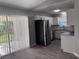 Kitchen area featuring stainless steel appliances, bright white cabinets, and modern fixtures at 4031 Wake Ave, Sarasota, FL 34241