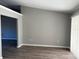 An open living room area, with fresh paint, laminate flooring and sliding doors to the outside at 4031 Wake Ave, Sarasota, FL 34241