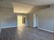 Bright living room featuring sleek laminate floors and fresh gray paint at 4031 Wake Ave, Sarasota, FL 34241