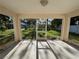 A screened patio offers an inviting outdoor living space and view of the yard at 4031 Wake Ave, Sarasota, FL 34241
