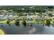 Aerial view of waterfront home with pool and screened-in enclosure at 4426 Useppa Dr, Bradenton, FL 34203