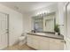 Bathroom features a single sink vanity with mirror, and tile flooring at 4426 Useppa Dr, Bradenton, FL 34203