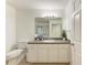 Well lit bathroom with a large mirror and a white sink with a gray countertop at 4426 Useppa Dr, Bradenton, FL 34203