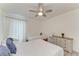 Well-lit bedroom offers comfortable sleeping arrangements, ceiling fan, and ample natural light at 4426 Useppa Dr, Bradenton, FL 34203