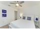 Comfortable bedroom featuring queen-size bed, wood-look flooring, a ceiling fan, and natural light at 4426 Useppa Dr, Bradenton, FL 34203