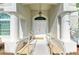 Inviting entryway featuring a welcoming ramp leading to a double door, framed by elegant columns at 4426 Useppa Dr, Bradenton, FL 34203