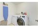 Well-equipped laundry room with washer, dryer, ironing board and ample storage at 4426 Useppa Dr, Bradenton, FL 34203