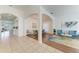 Bright, open-concept living space with arched doorways, tiled floors, and stylish furnishings at 4426 Useppa Dr, Bradenton, FL 34203
