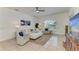 Spacious living room featuring tile flooring, large windows, and comfortable seating at 4426 Useppa Dr, Bradenton, FL 34203