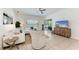 Bright living room with tile floors, comfortable white seating, and a view of the outdoors at 4426 Useppa Dr, Bradenton, FL 34203
