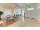 Open-concept living room and dining area with tile floors, modern decor, and ample natural light at 4426 Useppa Dr, Bradenton, FL 34203