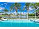 Beautiful screened-in pool and spa area, with lake view and tropical landscaping at 4426 Useppa Dr, Bradenton, FL 34203