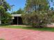 Charming single-story home featuring a screened porch and carport at 4845 Boca Raton Ave, Sarasota, FL 34234