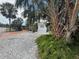 Cozy home with mature landscaping and a gravel yard, nestled in a quiet community at 4845 Boca Raton Ave, Sarasota, FL 34234