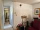 Bare hallway with thermostat on wall, shelving, and doorway at 4845 Boca Raton Ave, Sarasota, FL 34234