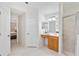 Bathroom featuring a vanity with drawers, a glass-enclosed shower, and tile floors at 4845 Post Pointe Dr, Sarasota, FL 34233