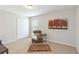 Bedroom featuring carpet floors, a closet, and a window with blinds at 4845 Post Pointe Dr, Sarasota, FL 34233