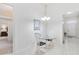 Bright breakfast nook with a glass table and stylish chairs, located near the entrance at 4845 Post Pointe Dr, Sarasota, FL 34233