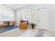 Inviting living room featuring bright light from the large bay window and a welcoming foyer at 4845 Post Pointe Dr, Sarasota, FL 34233