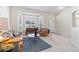 Inviting living room features bright light from the bay window and the front door at 4845 Post Pointe Dr, Sarasota, FL 34233