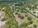 Lush land from above, dotted with mature trees at 5034 257Th E St, Myakka City, FL 34251