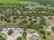 Expansive aerial view of the property featuring buildings, mature trees and surrounding landscapes at 5034 257Th E St, Myakka City, FL 34251