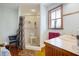 Bathroom featuring a tiled shower, and a bright window for natural light at 5034 257Th E St, Myakka City, FL 34251