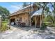Exterior view of the building featuring a outdoor wooden steps at 5034 257Th E St, Myakka City, FL 34251