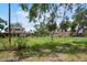 Exterior view of property including an exterior building and a large open grassy field at 5034 257Th E St, Myakka City, FL 34251