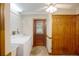 Functional laundry room with washer, dryer, and ample storage space at 5034 257Th E St, Myakka City, FL 34251
