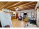 Open living space featuring exposed beams, wood floors, and ample natural light at 5034 257Th E St, Myakka City, FL 34251