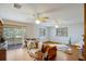 Living room featuring hardwood floors, large windows and an outdoor patio at 5034 257Th E St, Myakka City, FL 34251