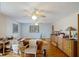 Living room featuring hardwood floors, lots of windows, and a ceiling fan at 5034 257Th E St, Myakka City, FL 34251
