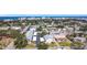 An aerial shot of a residential neighborhood near the water featuring diverse home styles and mature trees at 516 Parkdale Mews # 516, Venice, FL 34285