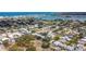 Aerial view showcasing a lush residential neighborhood near the bay with mature trees at 516 Parkdale Mews # 516, Venice, FL 34285